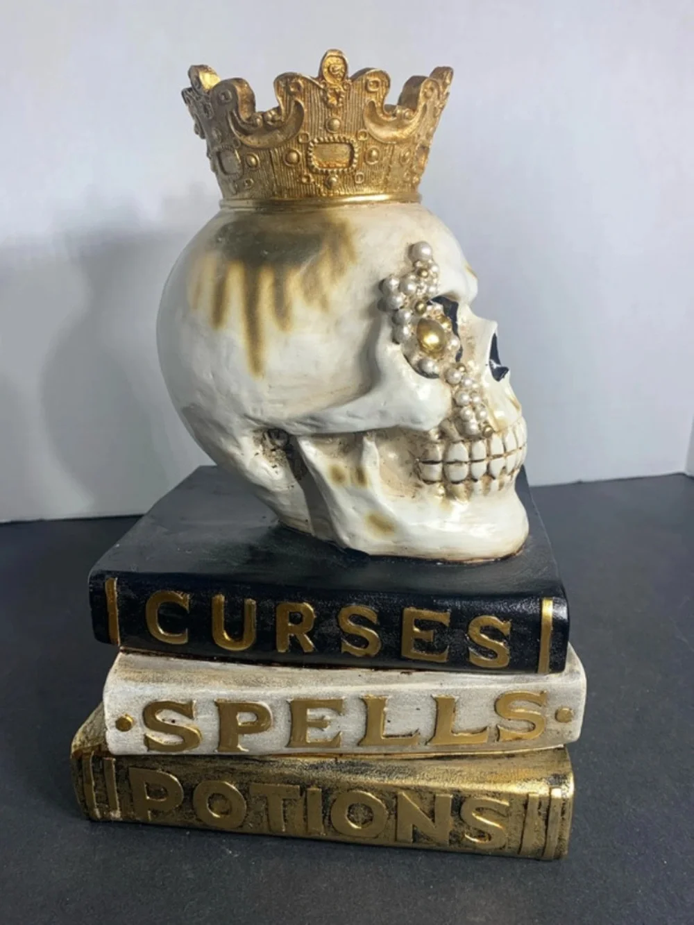 Decorative White and Gold Skull on Stacked Spell Books - Home Accent